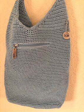 The Sak Light Gray Crochet Crossbody with Logo Charm